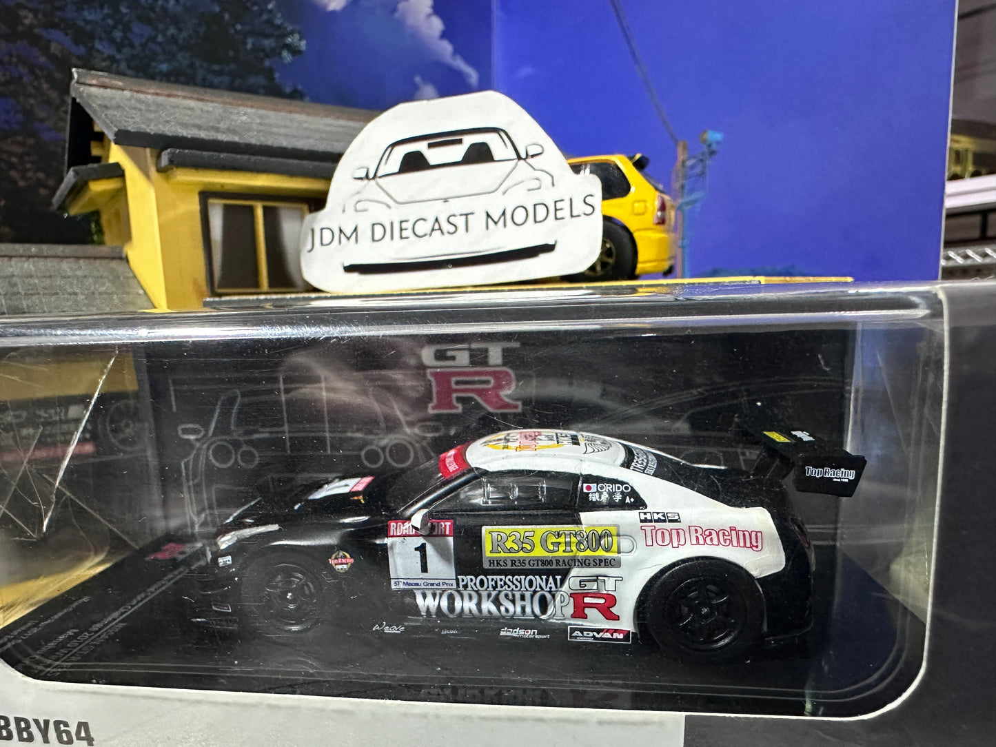 Tarmac Works 1/64 Nissan R35 Macau Road Sport Challenge 2010 Winner Manabu Orido