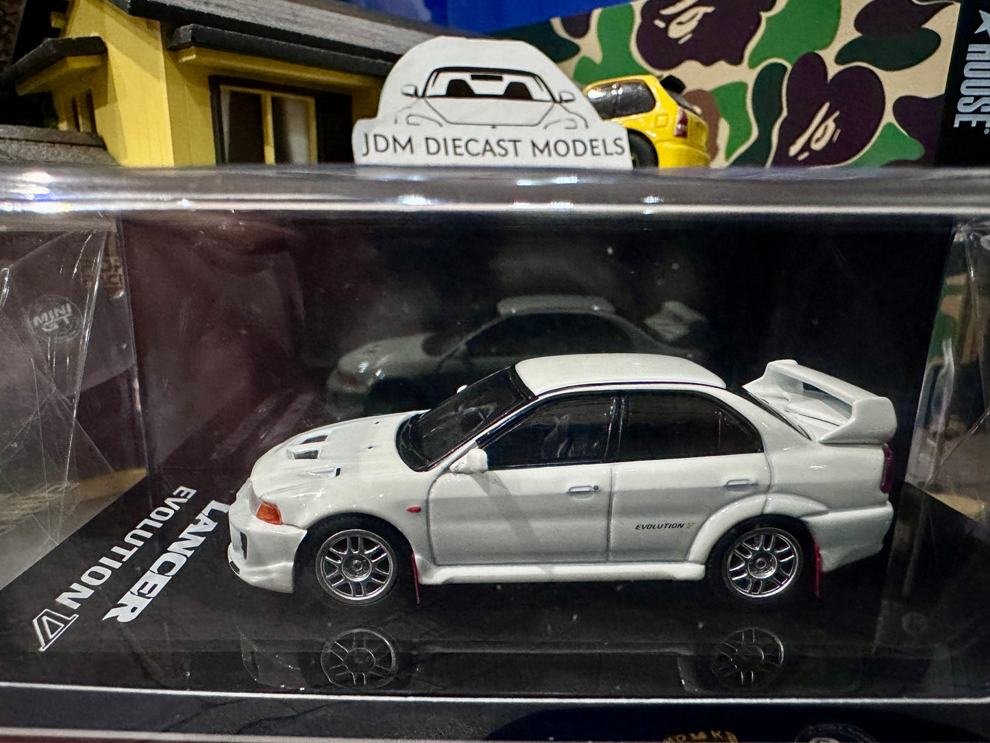 Hobby Japan Mitsubishi Lancer GSR Evolution V CP9A 1998 with Mud Flag Scortia White HJ642032AW