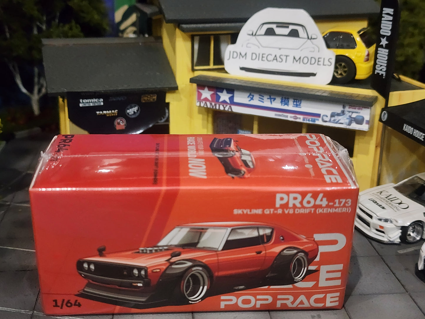 Poprace 1/64 Nissan Skyline KPGC110 Kenmari Orange PR64-173