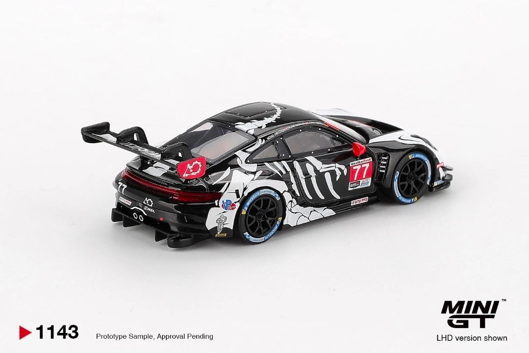 In STOCK MiniGT Porsche 911 GT3 R #77 AO Racing 2025 IMSA Petit Le