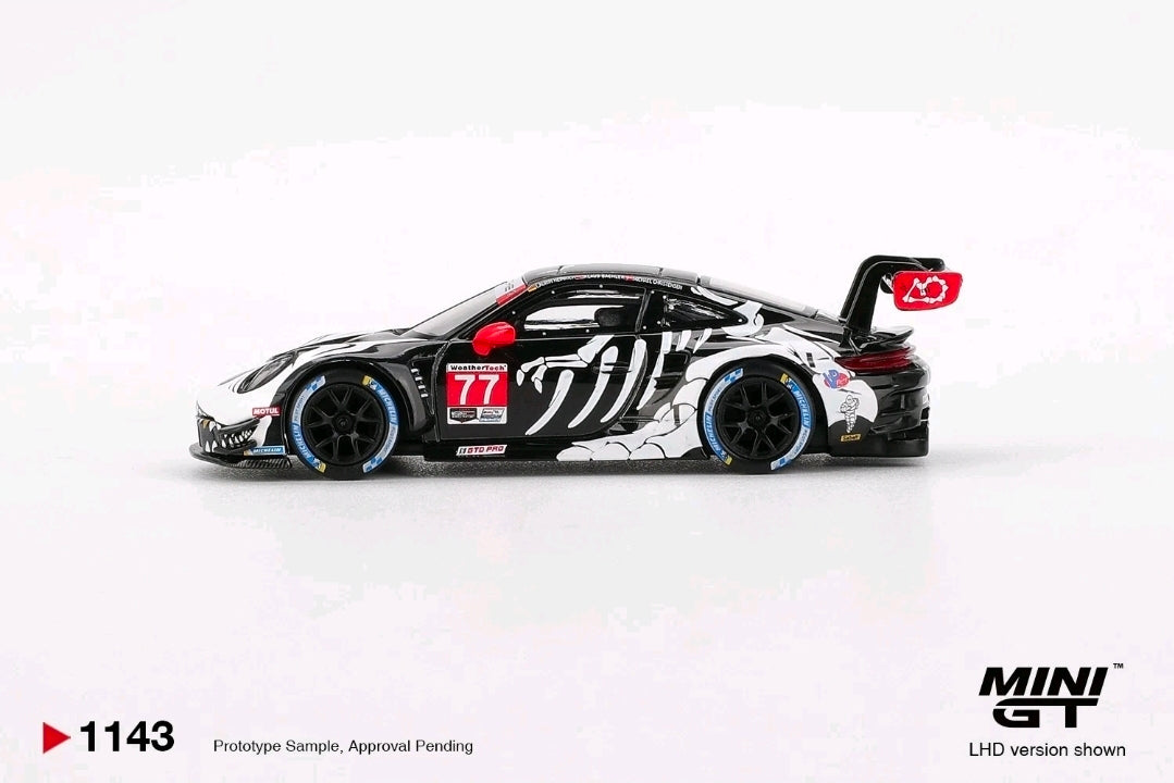 In STOCK MiniGT Porsche 911 GT3 R #77 AO Racing  2025 IMSA Petit Le Mans MGT01143